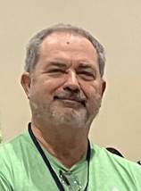 A person in a green shirt

AI-generated content may be incorrect.